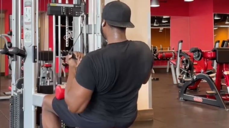 Coach Lee Boyce in gym doing back exercise